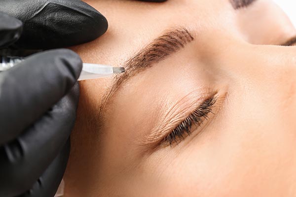 Microblading in progress by professional covered by Salon Insurance 4u's UK microblading insurance
