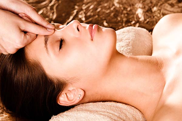 Person working as massage therapist, covered by public liability insurance