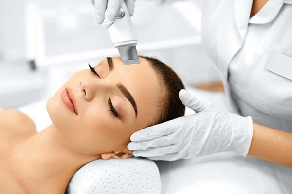 Woman working covered by a full beauty insurance package